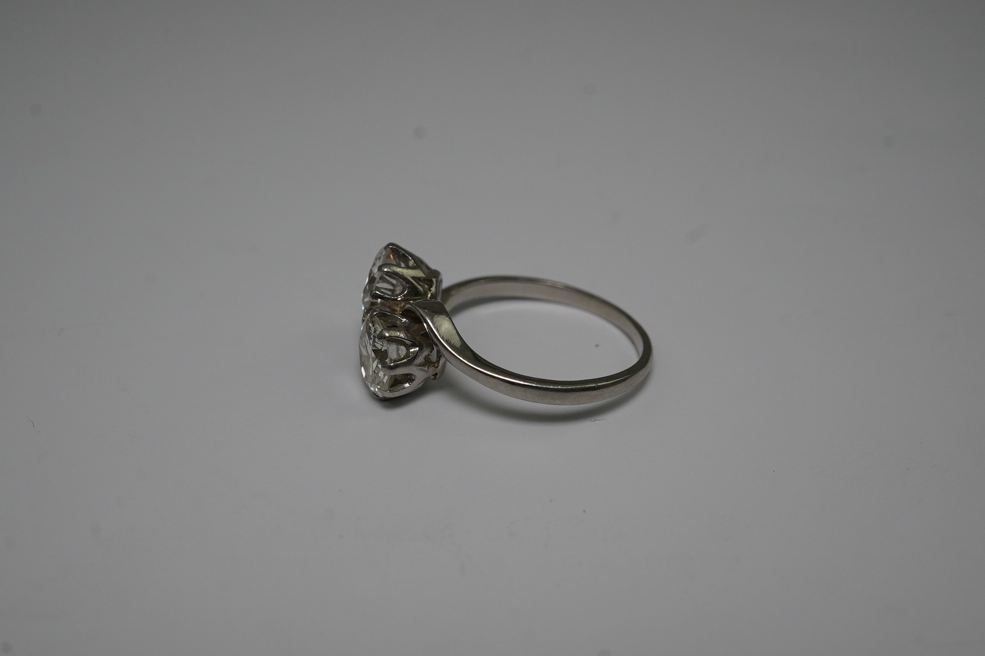 A platinum? and two stone diamond set crossover ring